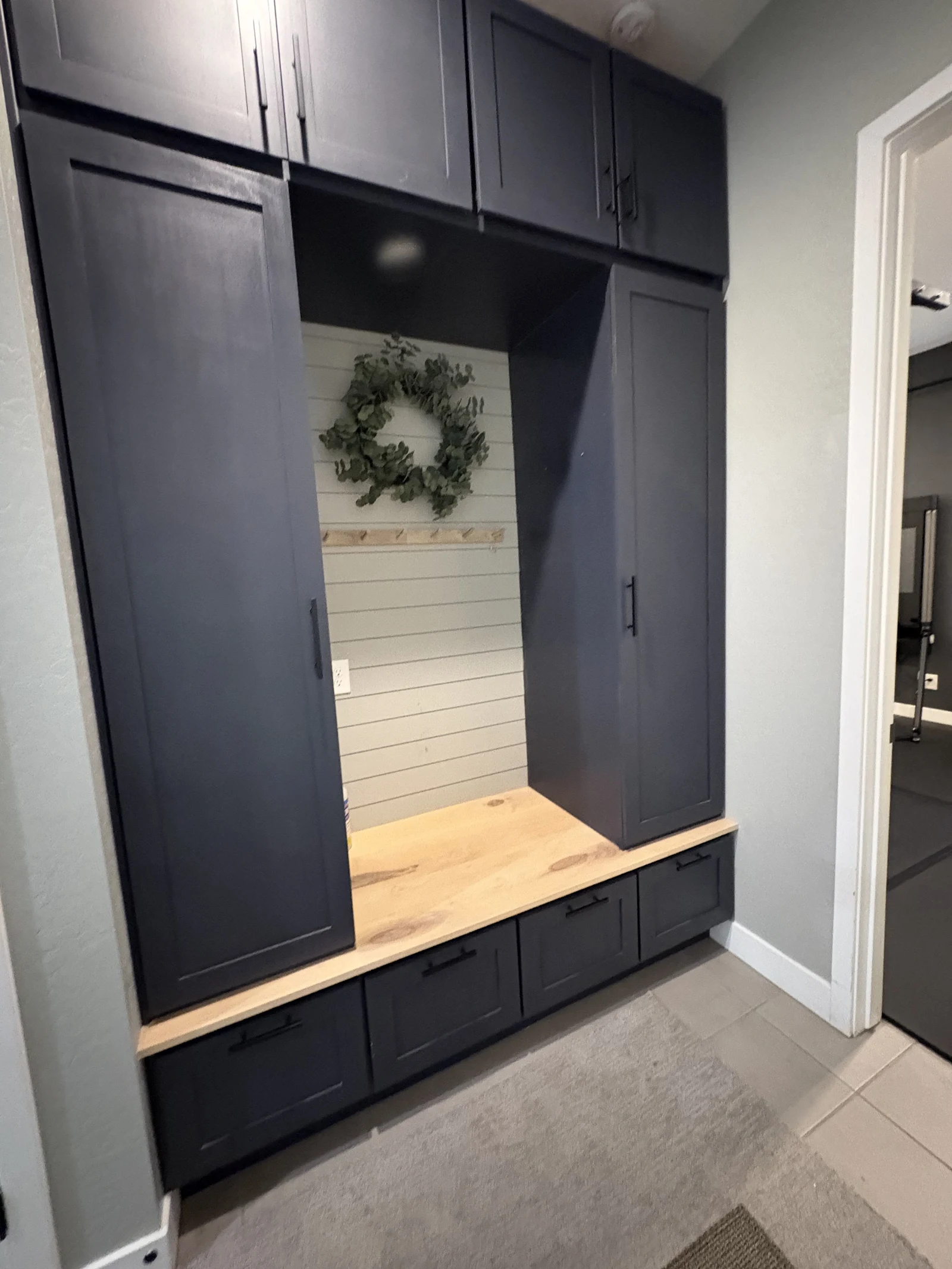 Full-height dark entry built-in cabinetry