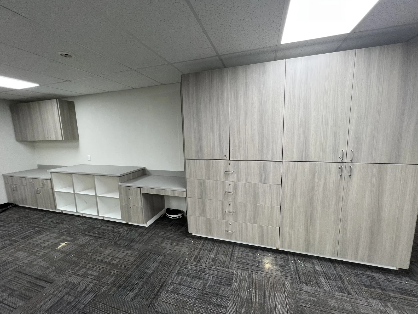 Light gray commercial storage cabinetry wall