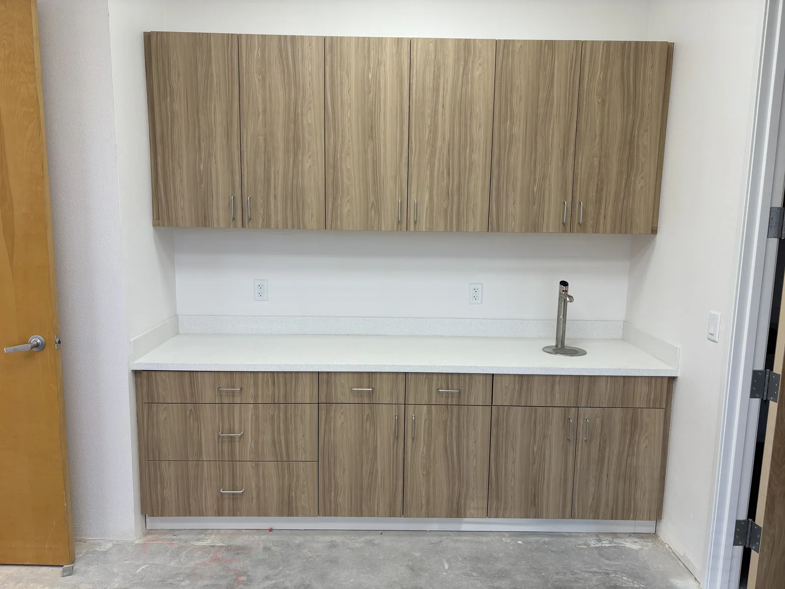 Modern office millwork with slab cabinet fronts