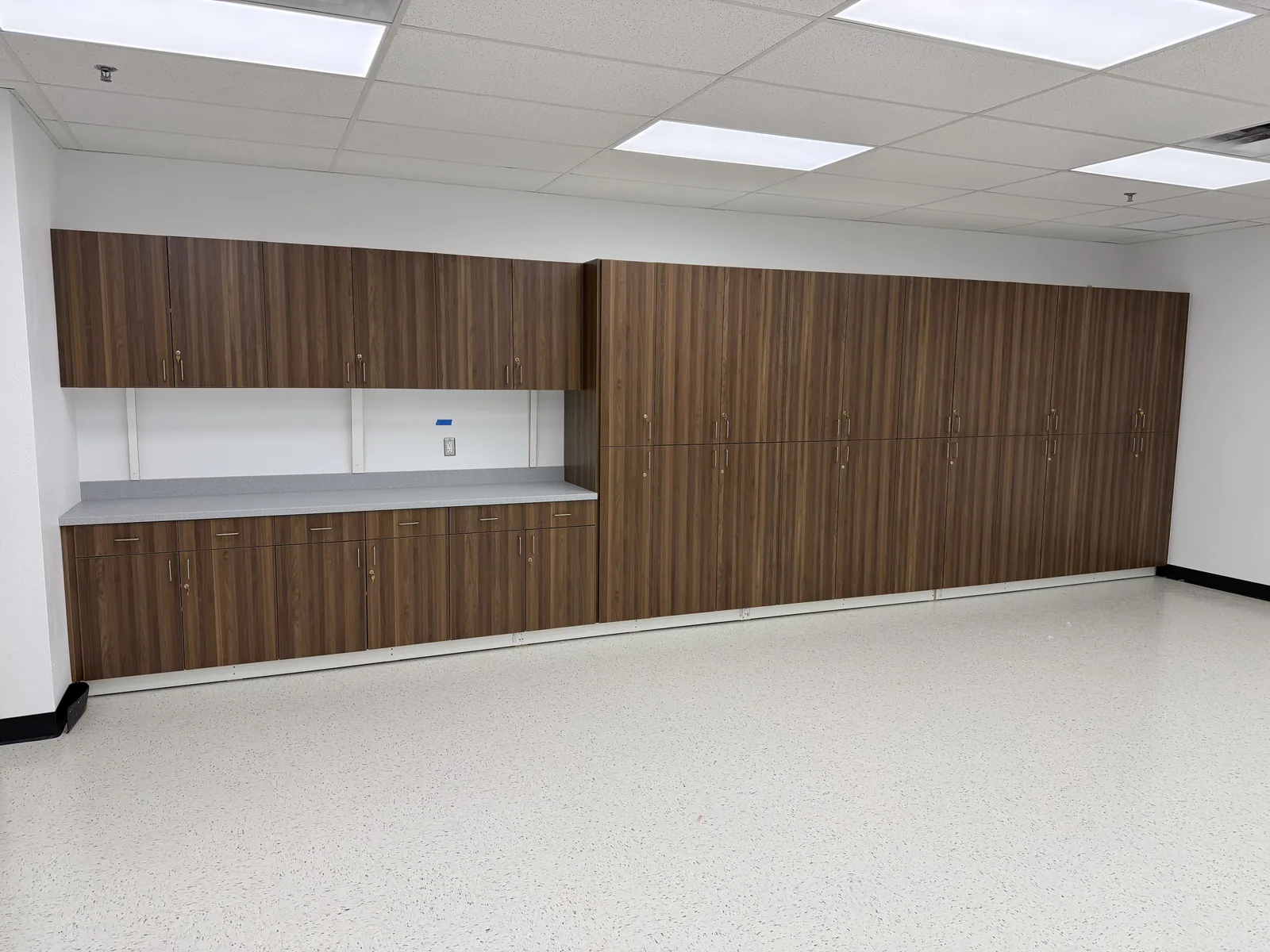 Long office millwork installation with integrated countertop