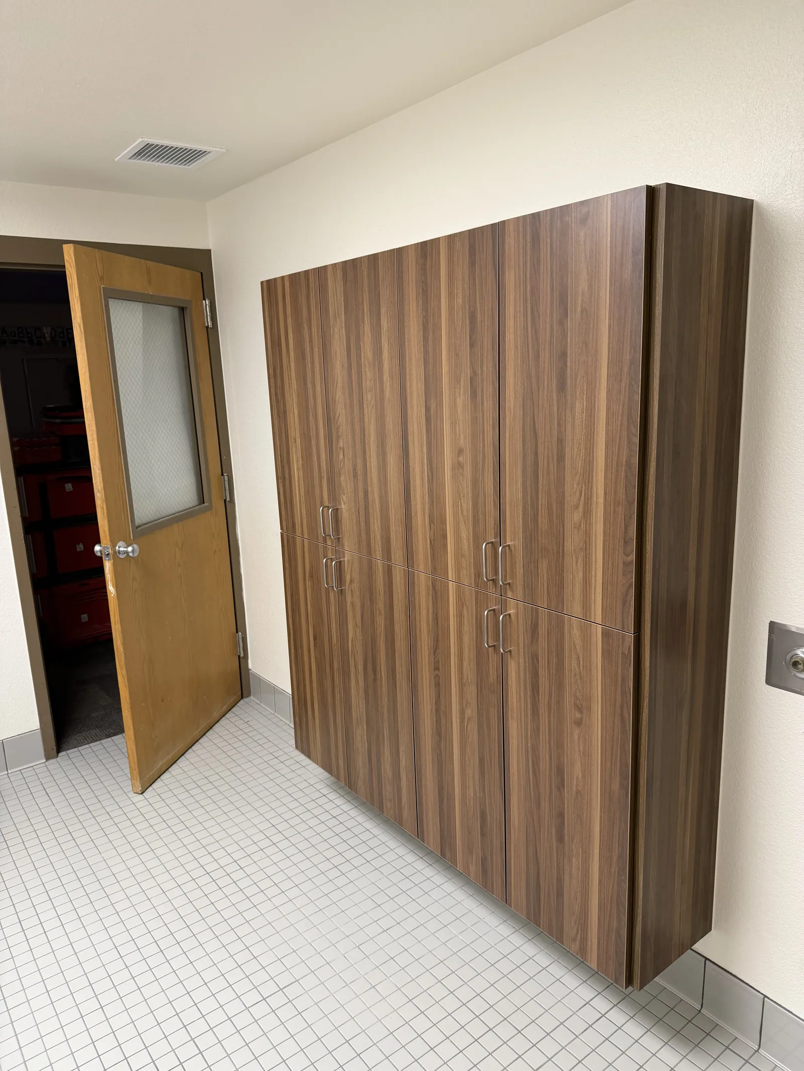 Tall office storage cabinets with continuous wood grain