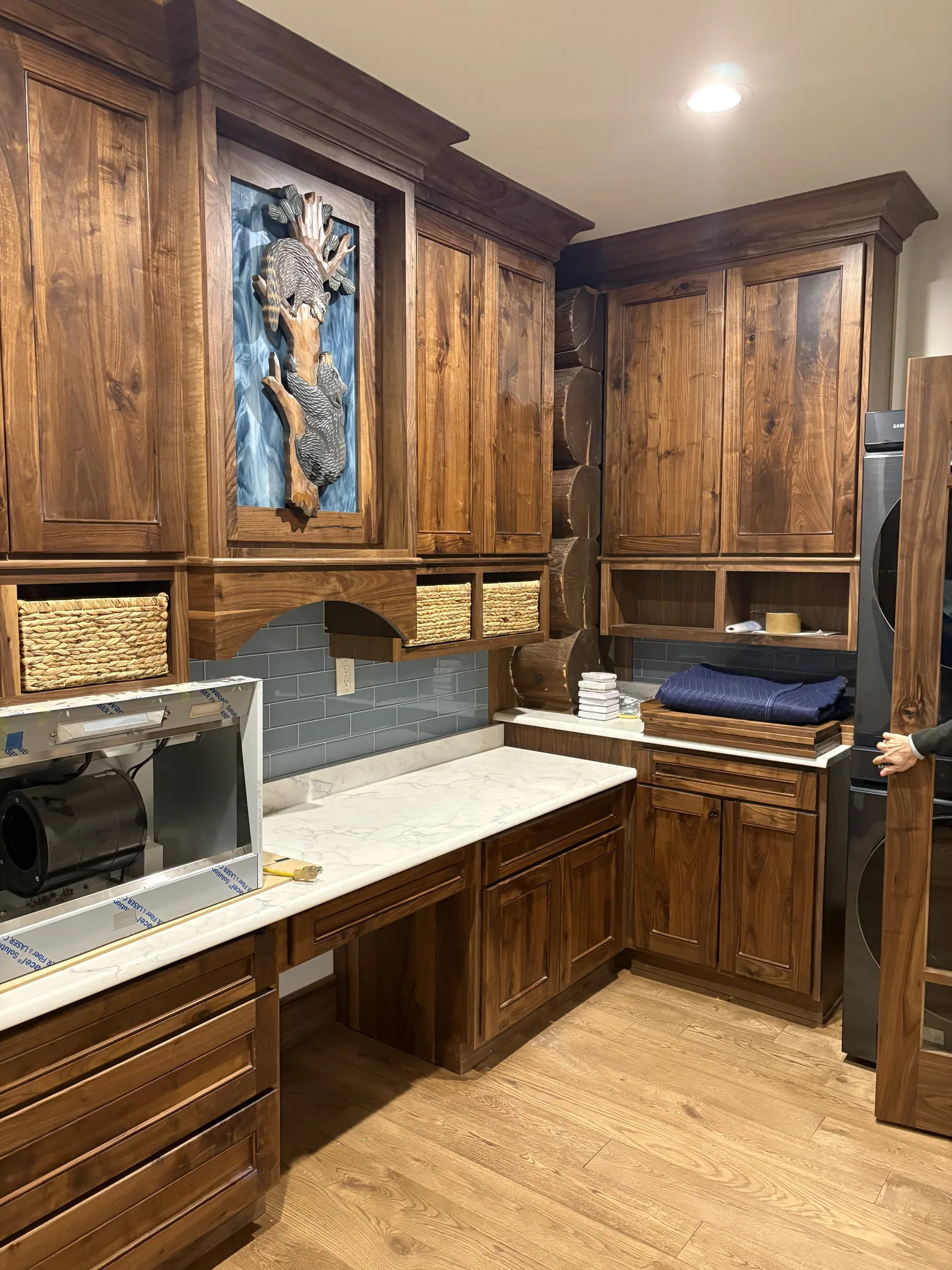 Walnut kitchen cabinetry and integrated storage