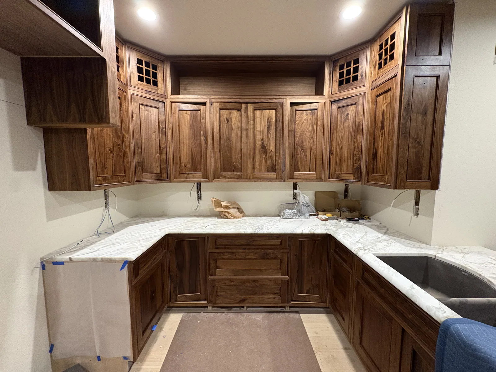 Walnut kitchen cabinets wrapping a corner workspace